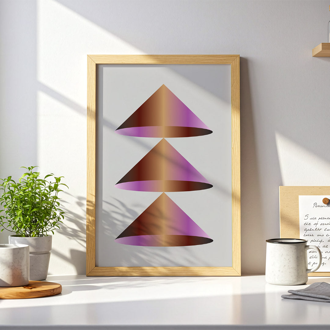 Framed abstract art piece on a desk with decor items