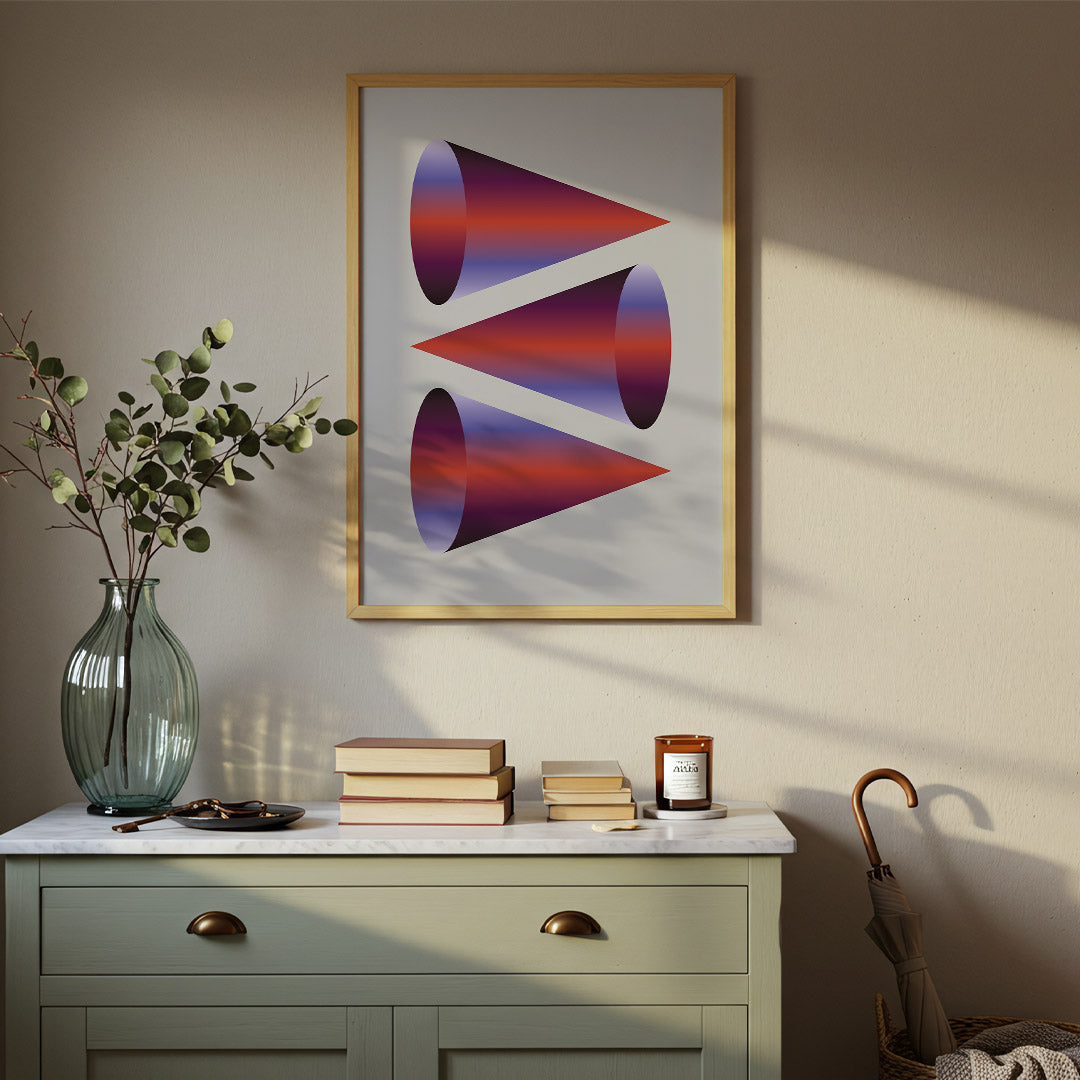 Framed abstract art on a wall above a dresser with decorative items.