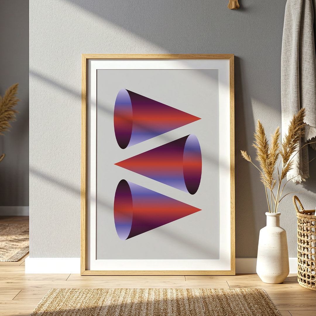 Framed abstract art print of geometric shapes on a wall in a home setting.