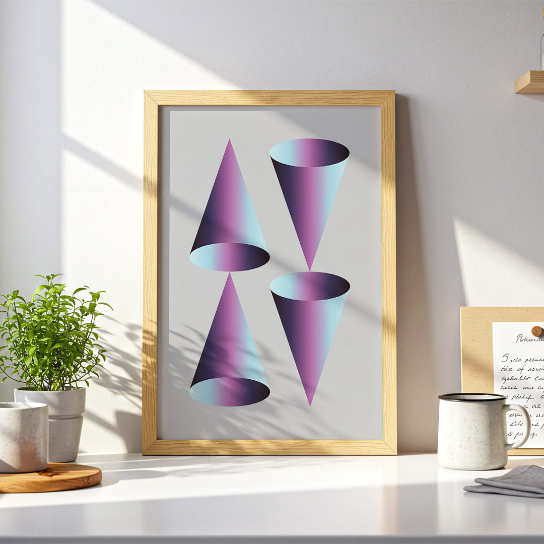 Framed abstract art print of colorful geometric shapes on a desk with decor items.