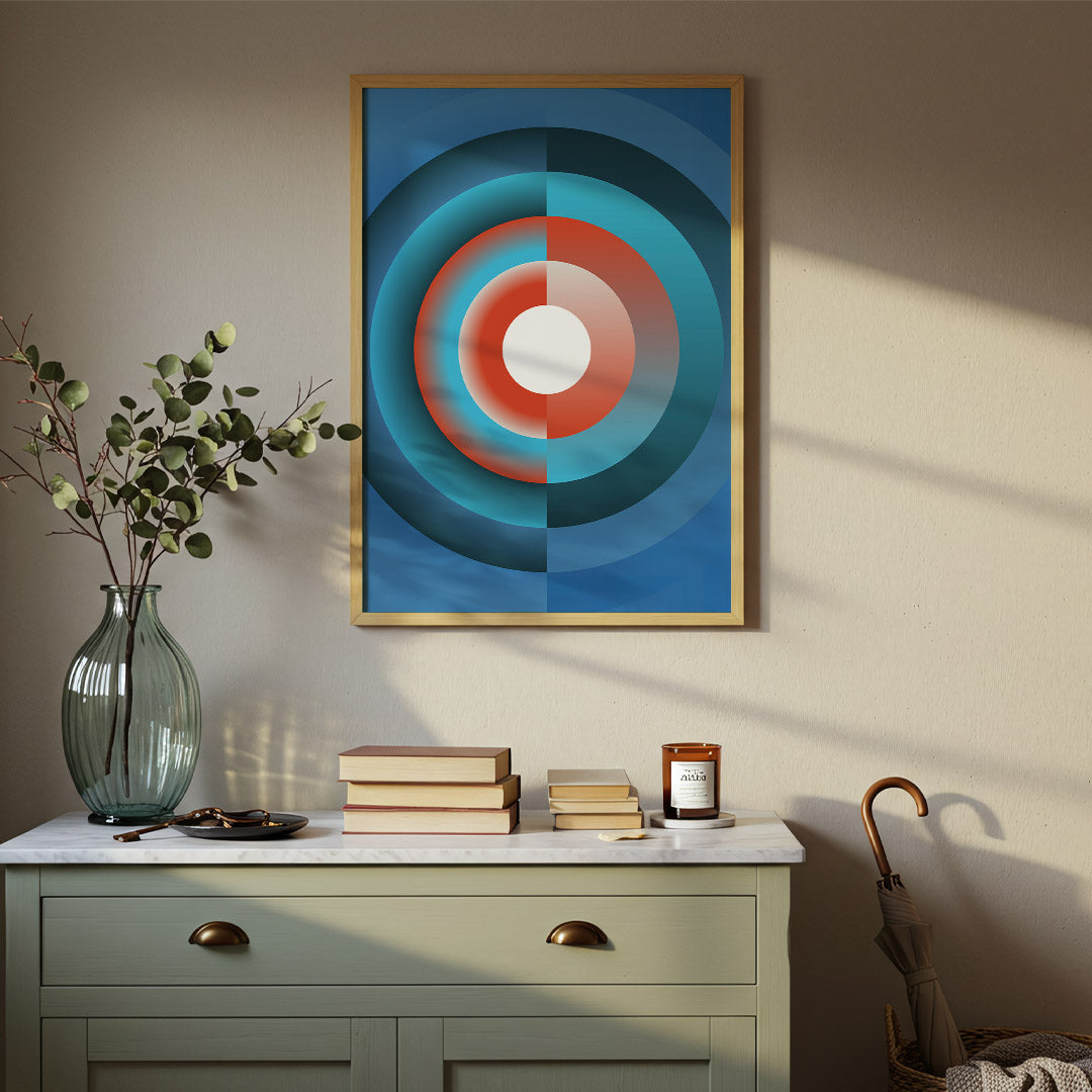 Abstract circular artwork on a wall above a dresser with decorative items.
