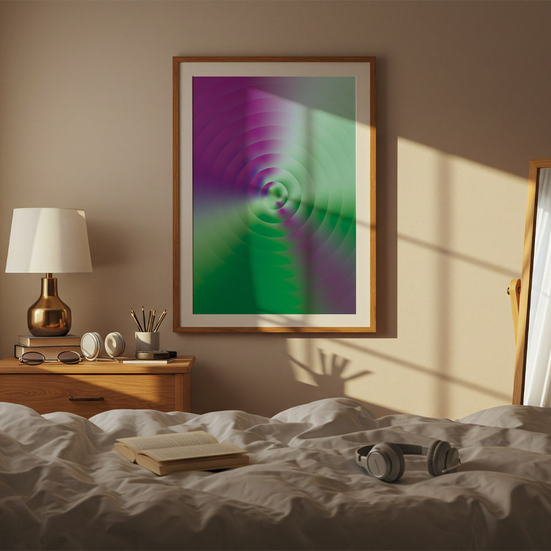 Framed abstract art on a wall above a bed with books and headphones.