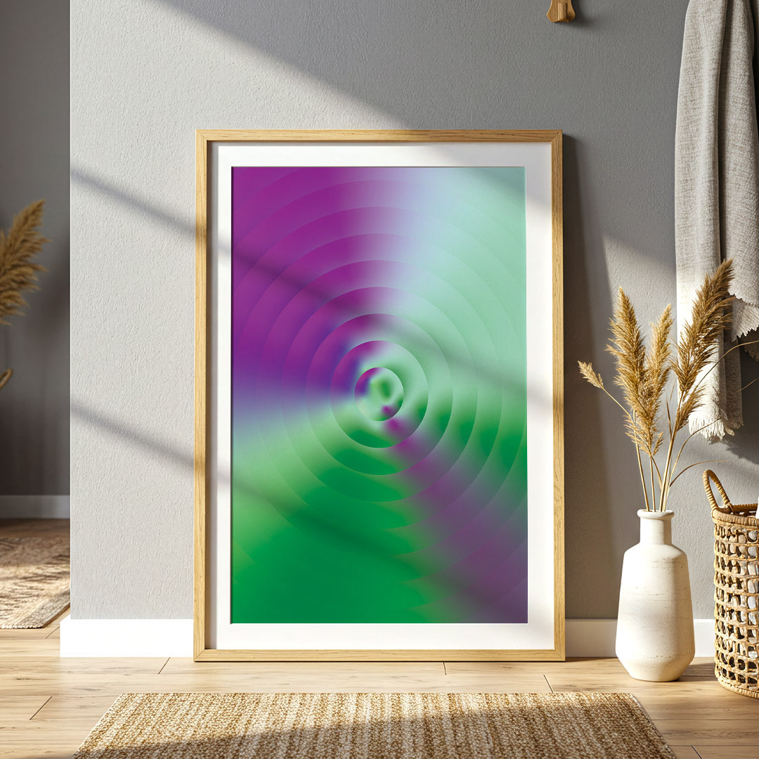 Framed abstract art with purple and green spiral design on a wall in a room with decor elements.