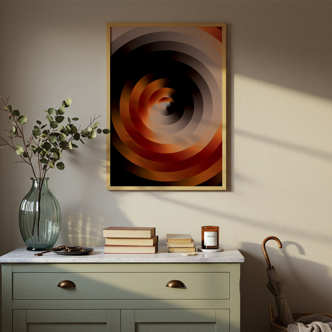 Decorative setup with a spiral art piece, vase, books, and candle on a dresser.